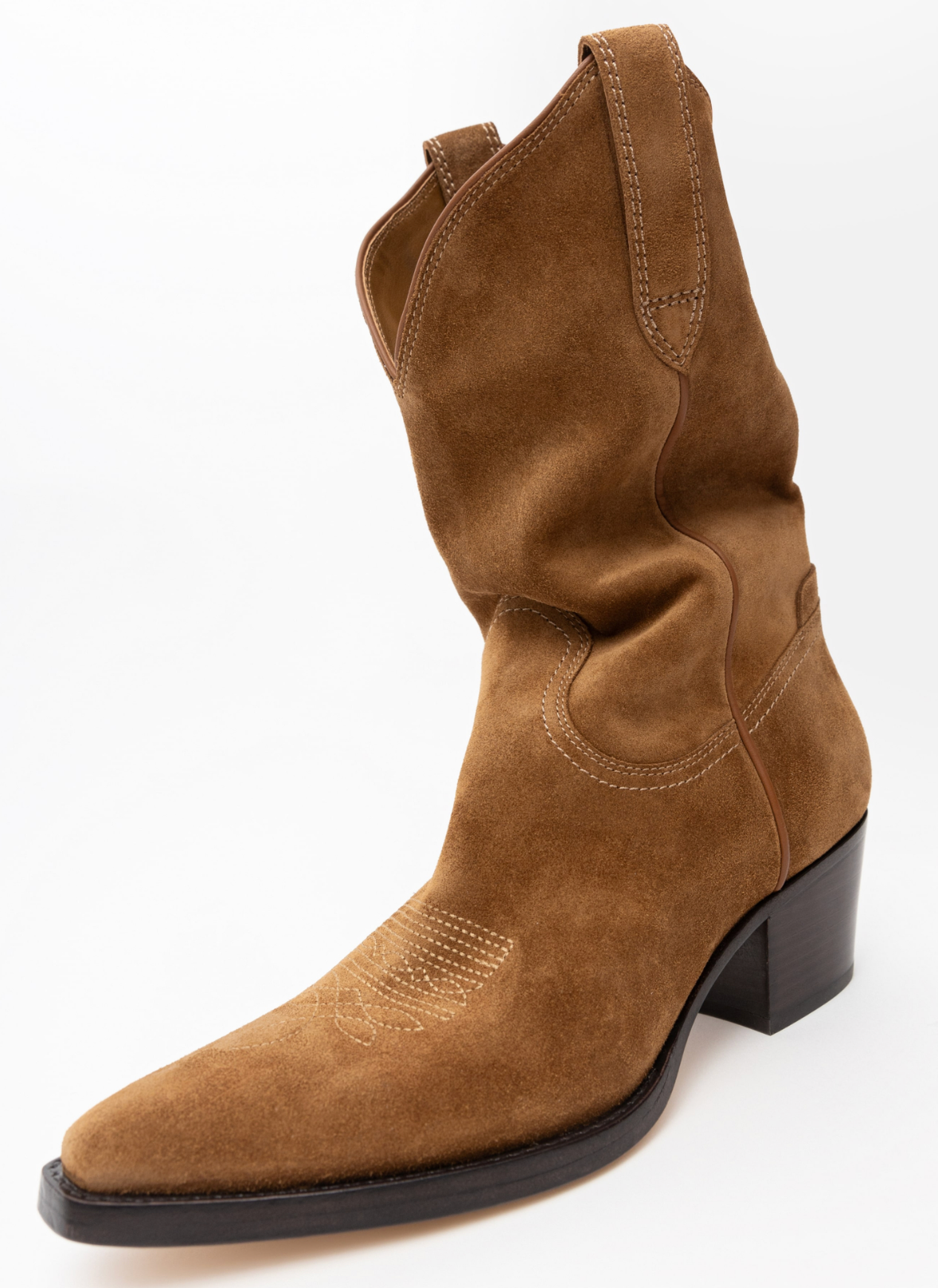 A brown suede mid-calf western boot with a pointed toe and black block heel, shown from a three-quarters angle on a white background.