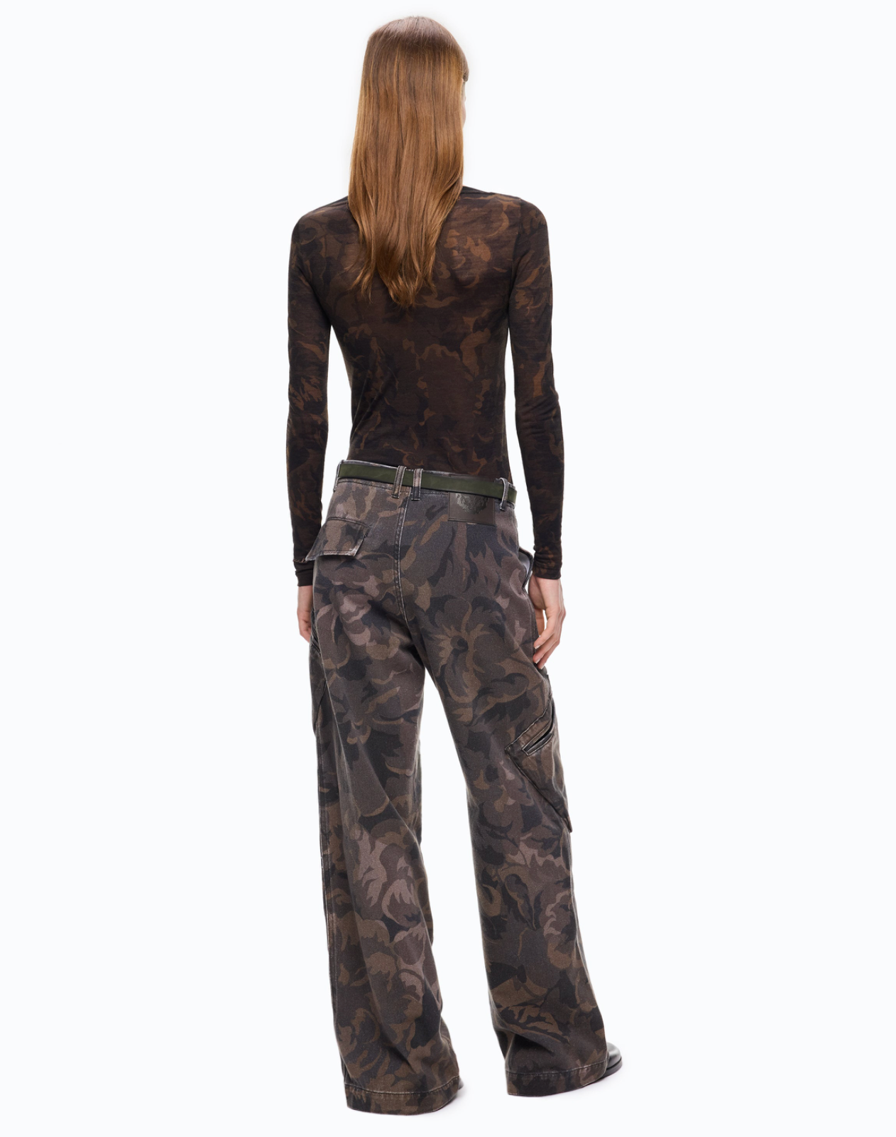 A woman shown from the back wearing a dark brown camouflage long-sleeve top and matching wide-leg cargo pants with a dark belt, against a plain white background.