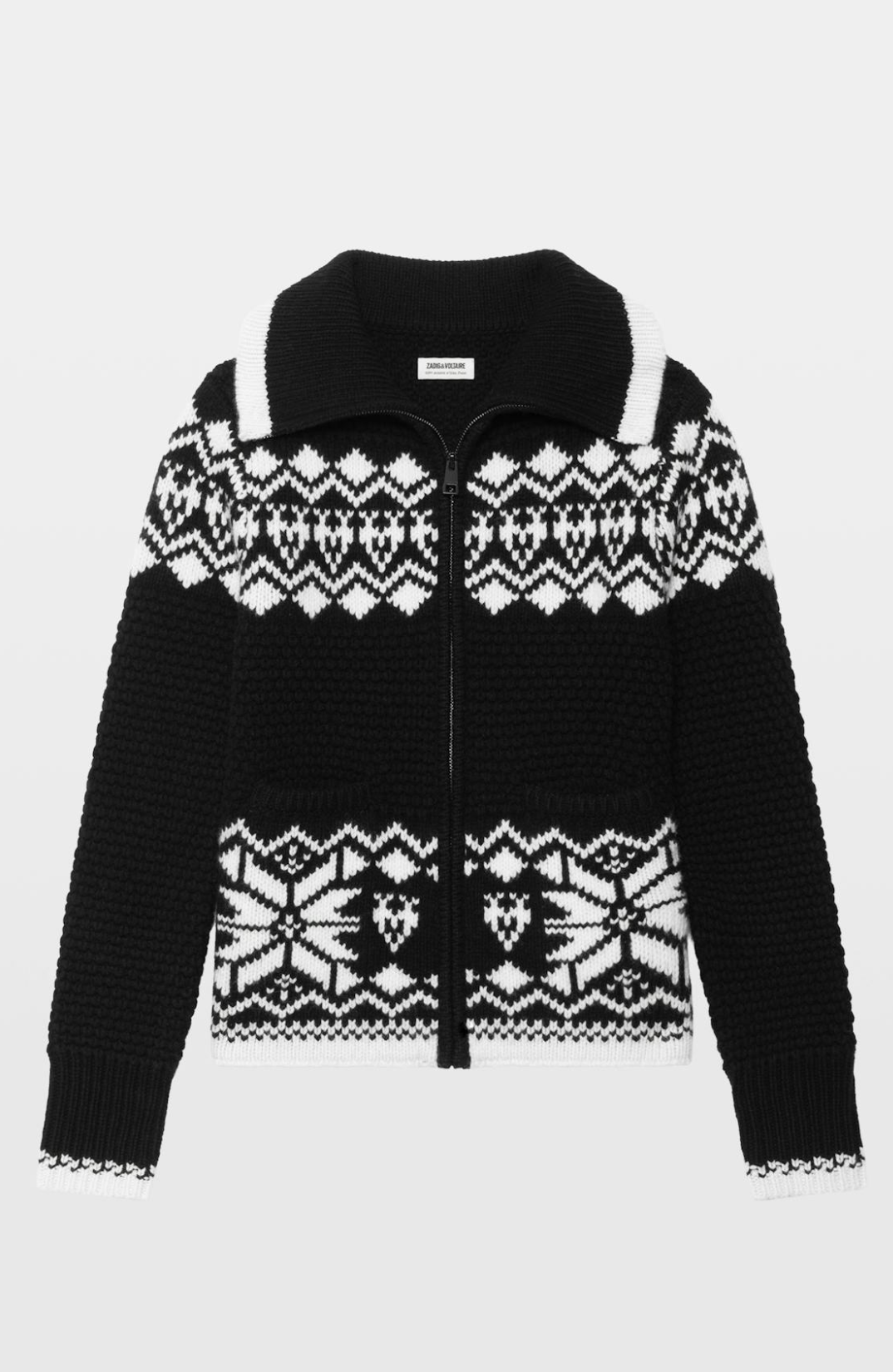 A black knit zip-up cardigan featuring a white Fair Isle pattern across the yoke, cuffs, and hem, displayed on a light gray background.